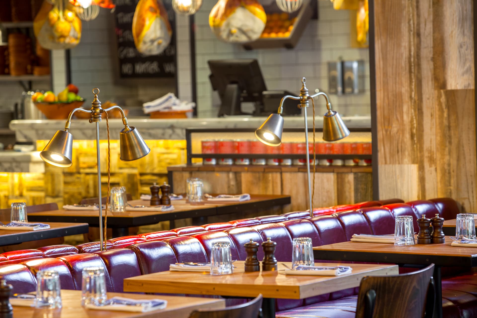 Open pass with cured meats, marble counter and task lighting