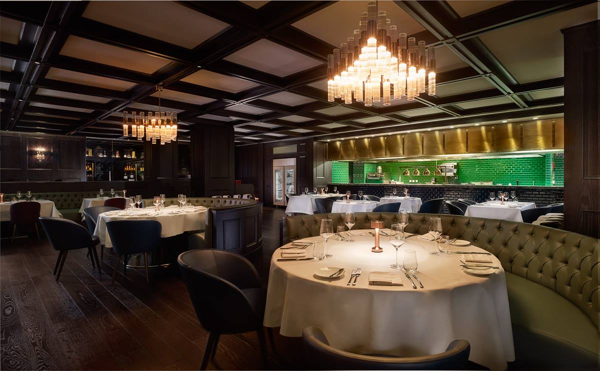 Dark timber dining room with coffered ceiling and parquet flooring