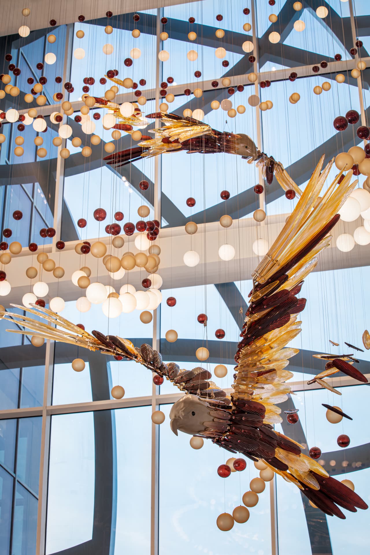 Glass falcons against the curtain-wall glazing and daylight